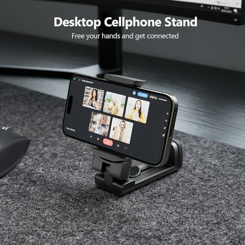 Cellphone on stand showing video call on desk.